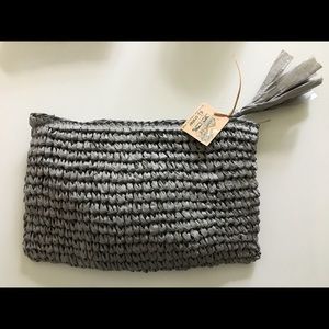 Straw Clutch with zipper closure.